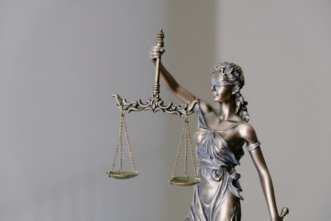 Legal gavel and statute book on a desk